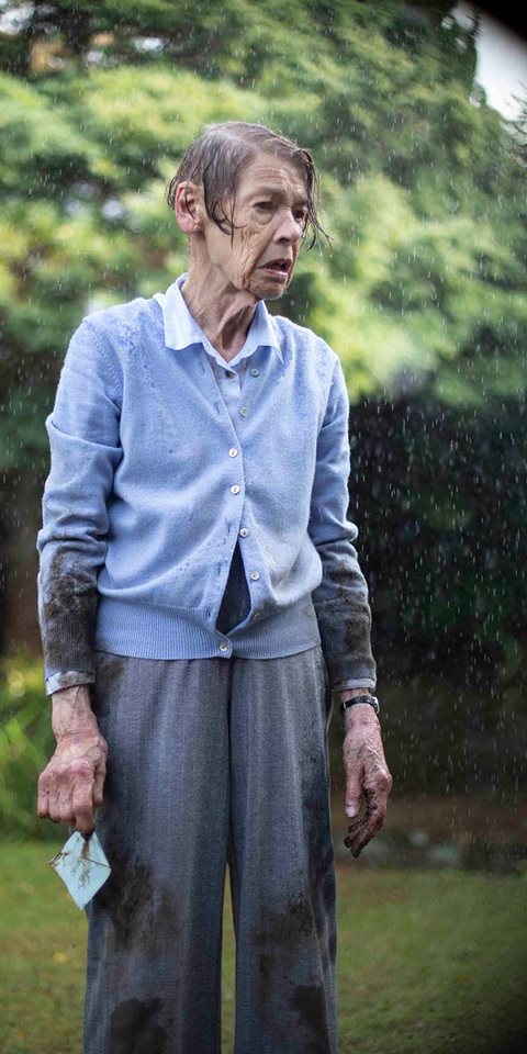 Woman standing in the rain.